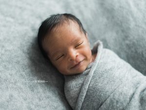 smiling newborn baby